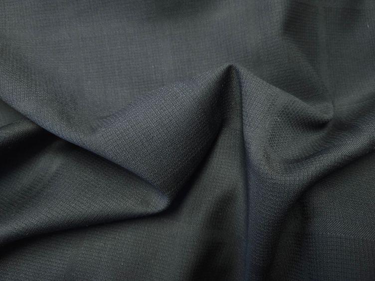 Wollstoff Ton in Ton, schwarz